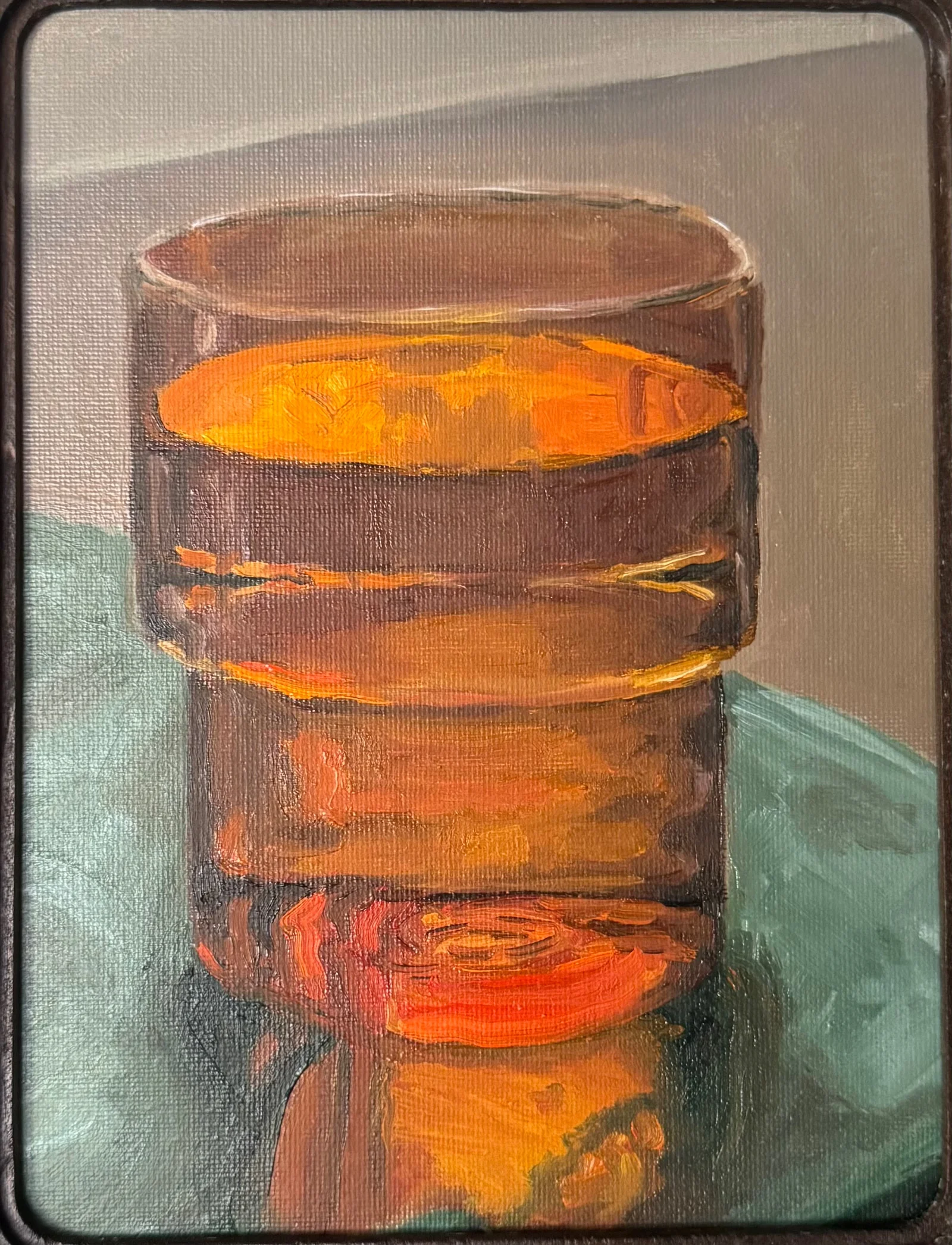 Still life painting of an amber glass on a teal surface with light passing through