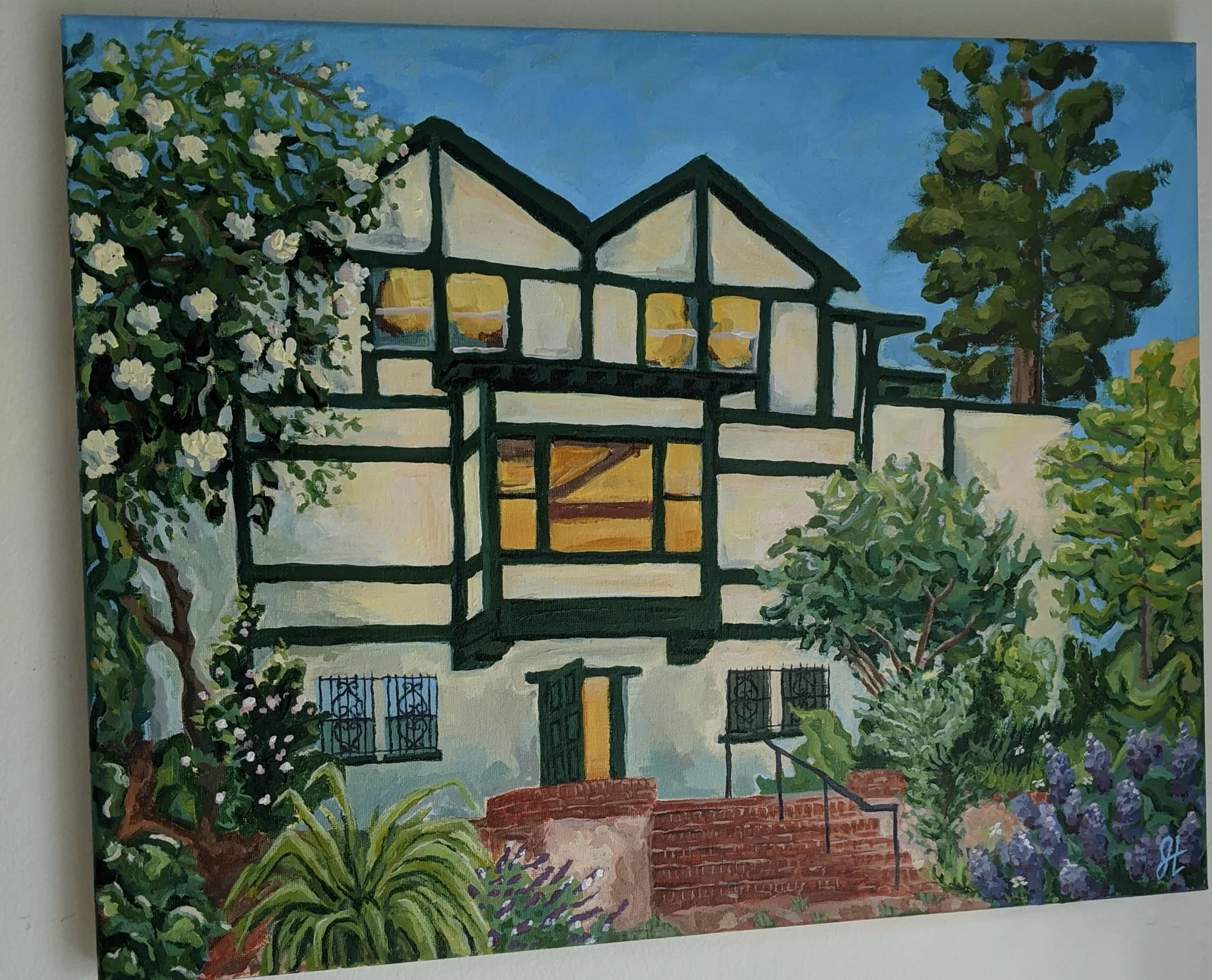 Painting of a Tudor-style house with flowering trees and a brick stairway